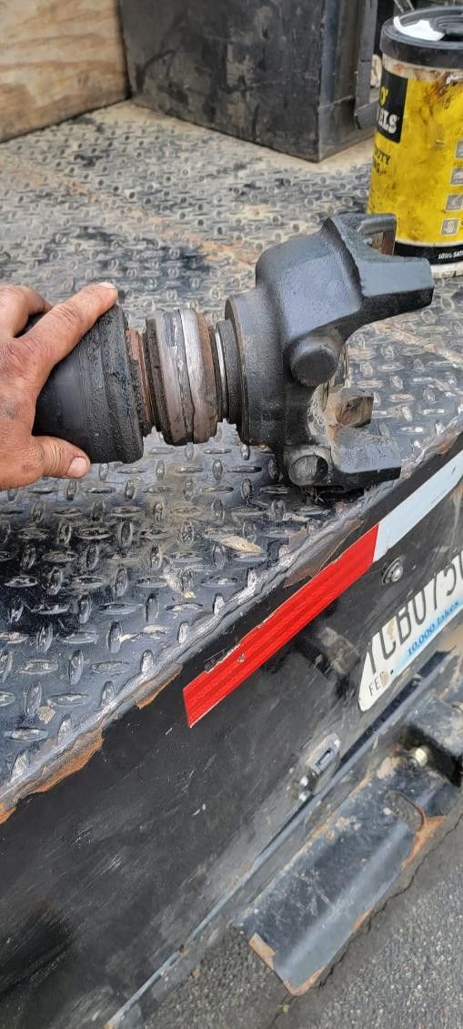 Driveshaft yoke and U-joint removed for driveline repair