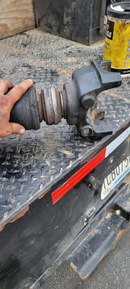 Driveshaft yoke and U-joint removed for driveline repair