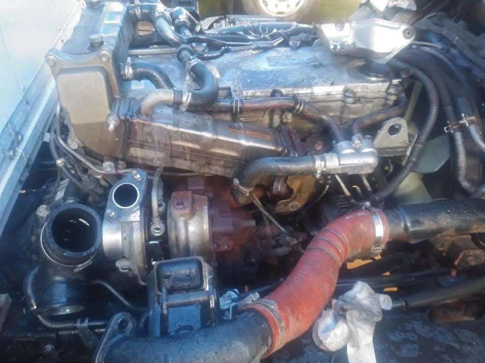 Diesel engine turbocharger and intake piping during a mobile repair