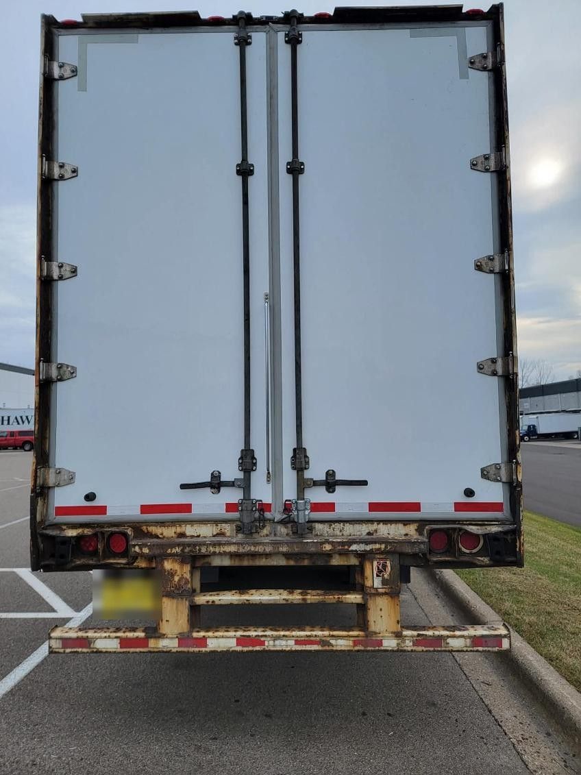 Rear doors and underride guard of a reefer trailer