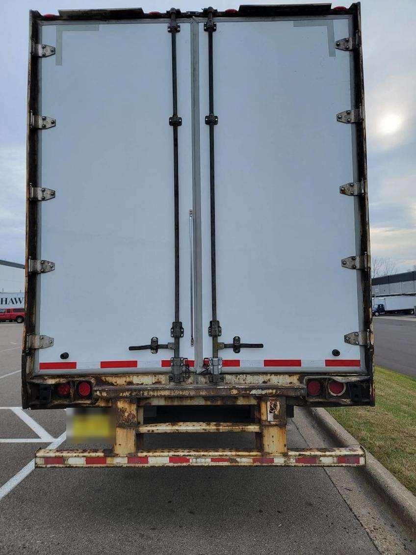 Rear doors and underride guard of a reefer trailer