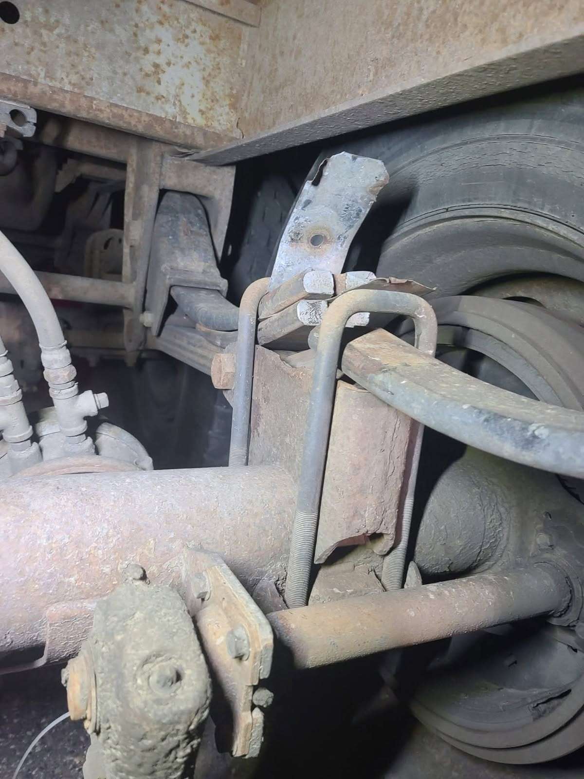Truck leaf spring suspension and axle inspected from underneath