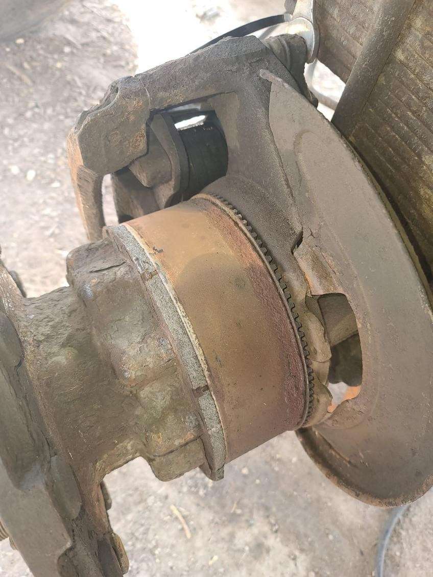 Truck wheel end and brake rotor inspected for wear